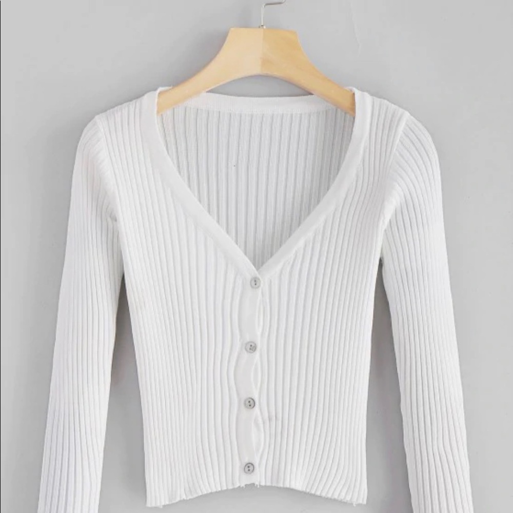cropped white long sleeved shirt